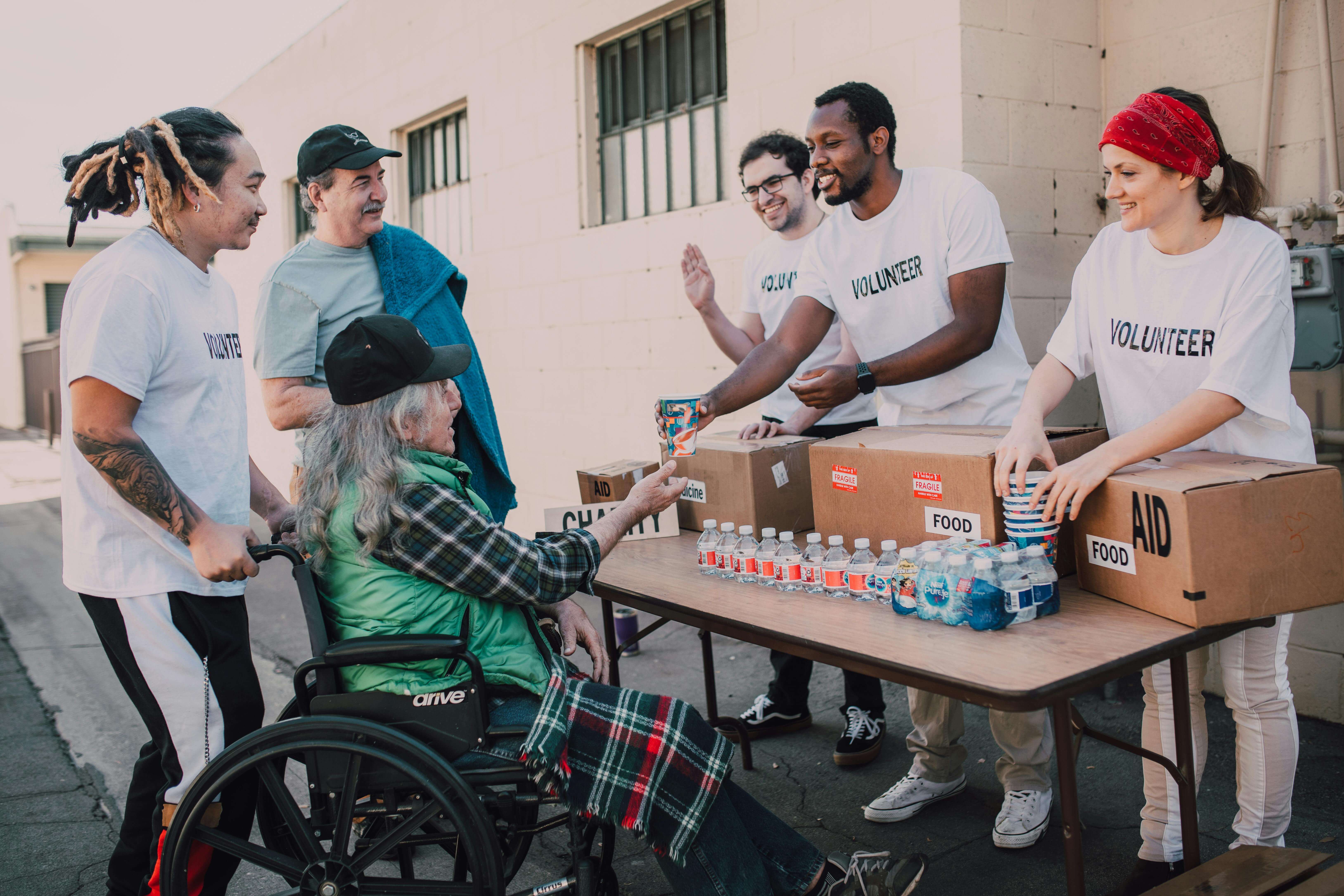A volunteer serving hot meals